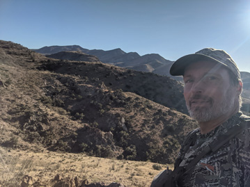 Coues deer hunting hiking up mountain