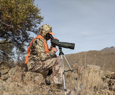 spotting for deer from rocky outcropping