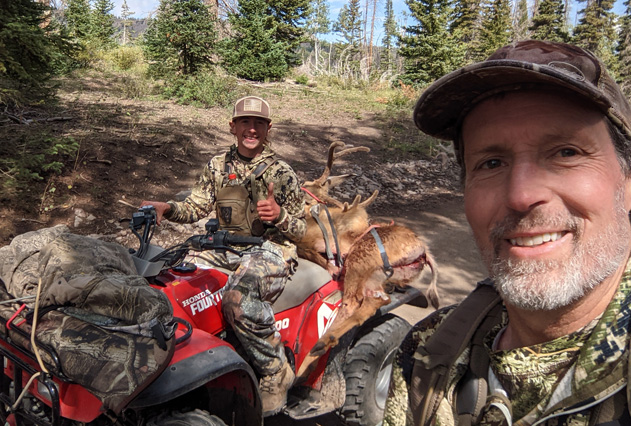 back to camp on 4 wheeler with buck deer