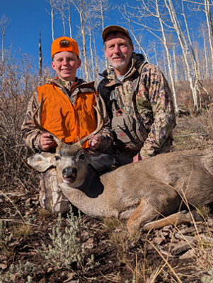 Proud Grandpa with Daxton & 4-point buck 4-point buck mule deer